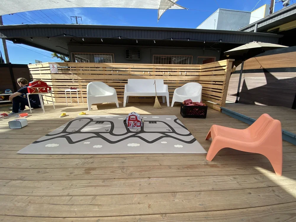 Outdoor deck seating and Ruggish play rug
