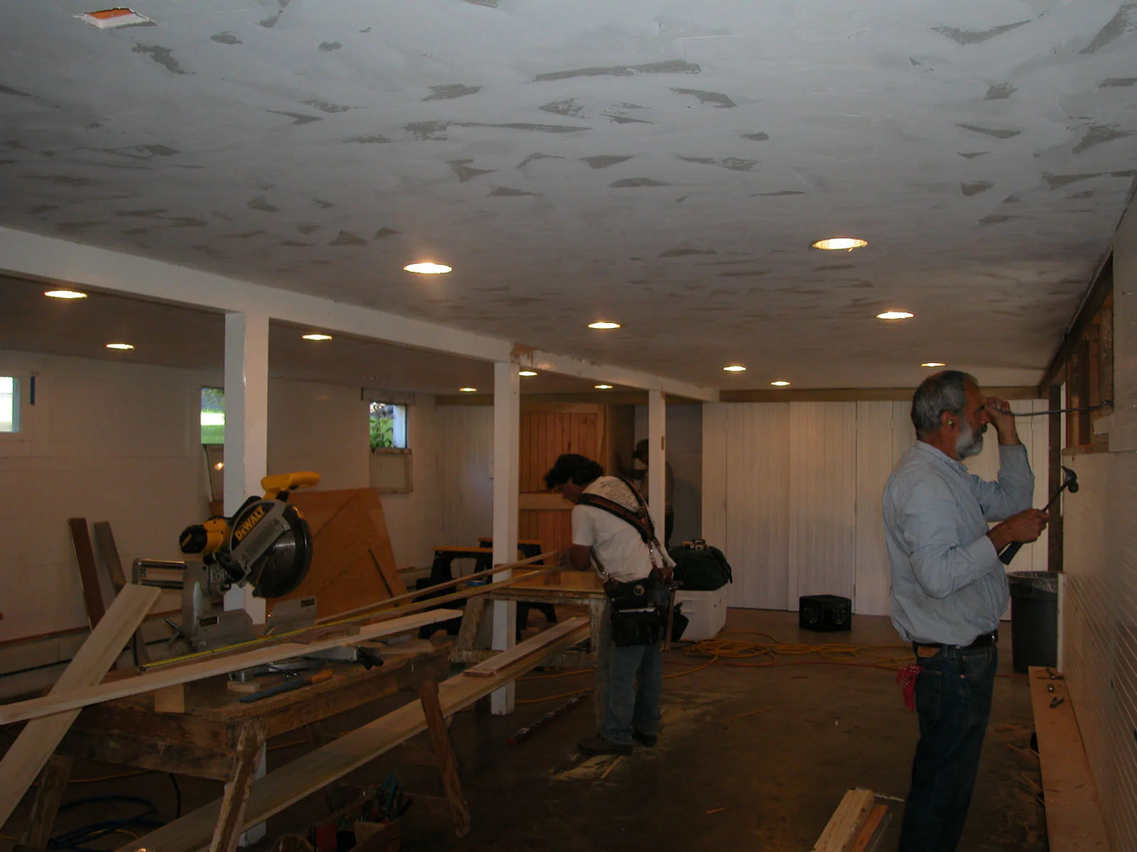 Volunteer construction crew working on a basement upgrade.