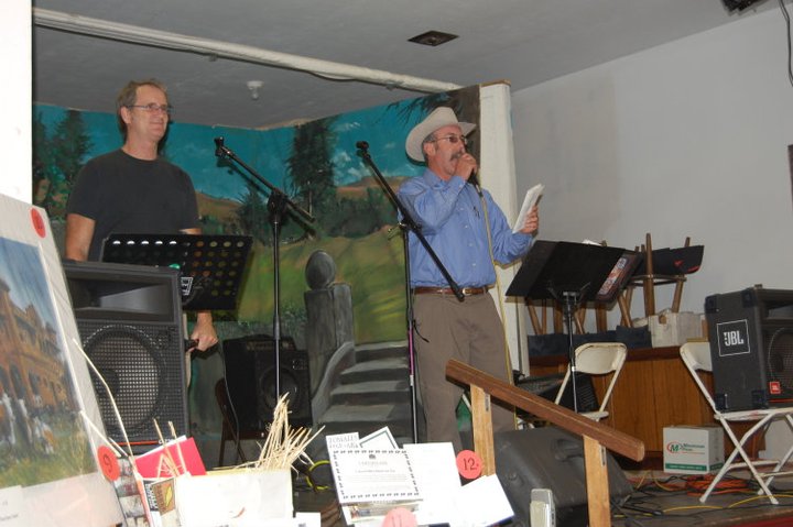Auction at the Tomales Town Hall Pig Roast Fundraiser, with Bert Crews (l) and auctioneer (r), 2009.