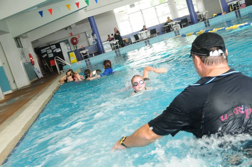 These children are discovering how difficult it is to swim against the current. By having the kids recognise the limits of their abilities in a current, we a linking their learning to reality and eliminating any over-imagined belief in their abilities,