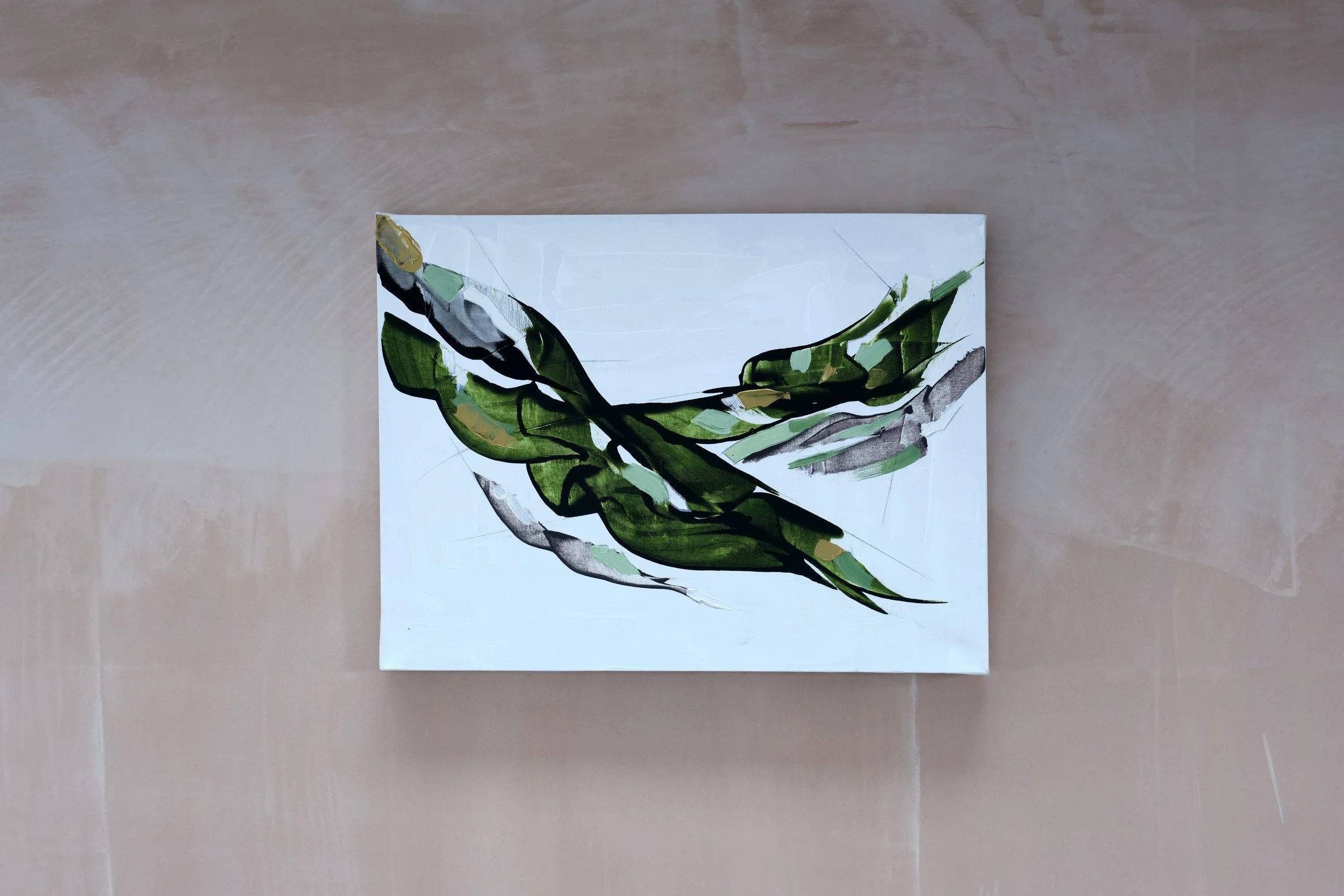 Abstract painting of green and black leaves on white background