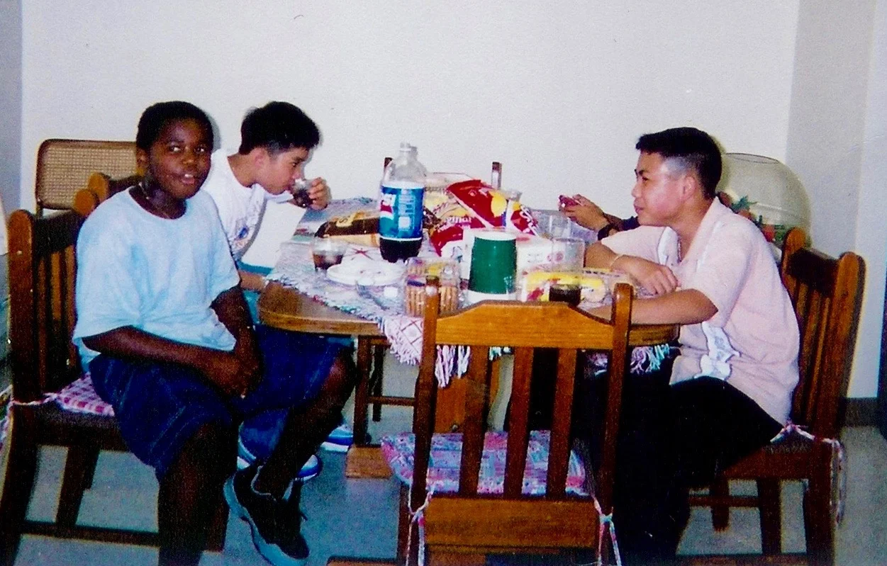 Deo and his classmates from his ESOL class celebrating a birthday