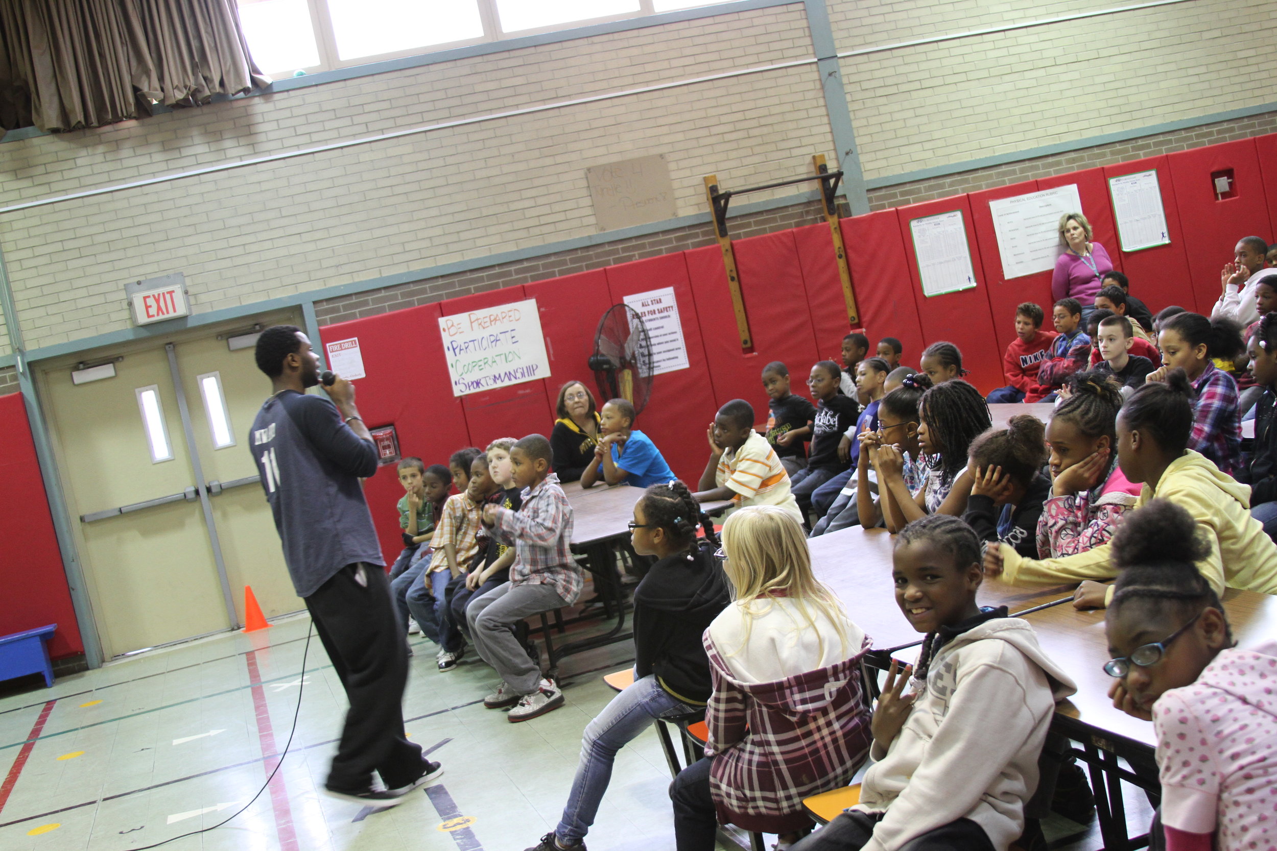 Deo speaking to a group of students in Pittsburgh, PA