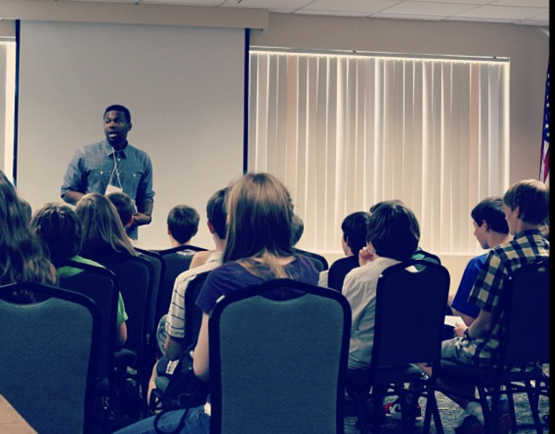 Deo Mwano leading a workshop on how to create an inclusive space with a student group