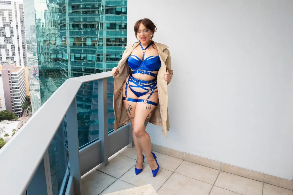 Zoey Belladonna, NYC Dominatrix, photographed in chic blue strappy lingerie, and heels representing gentle femdom in New York.