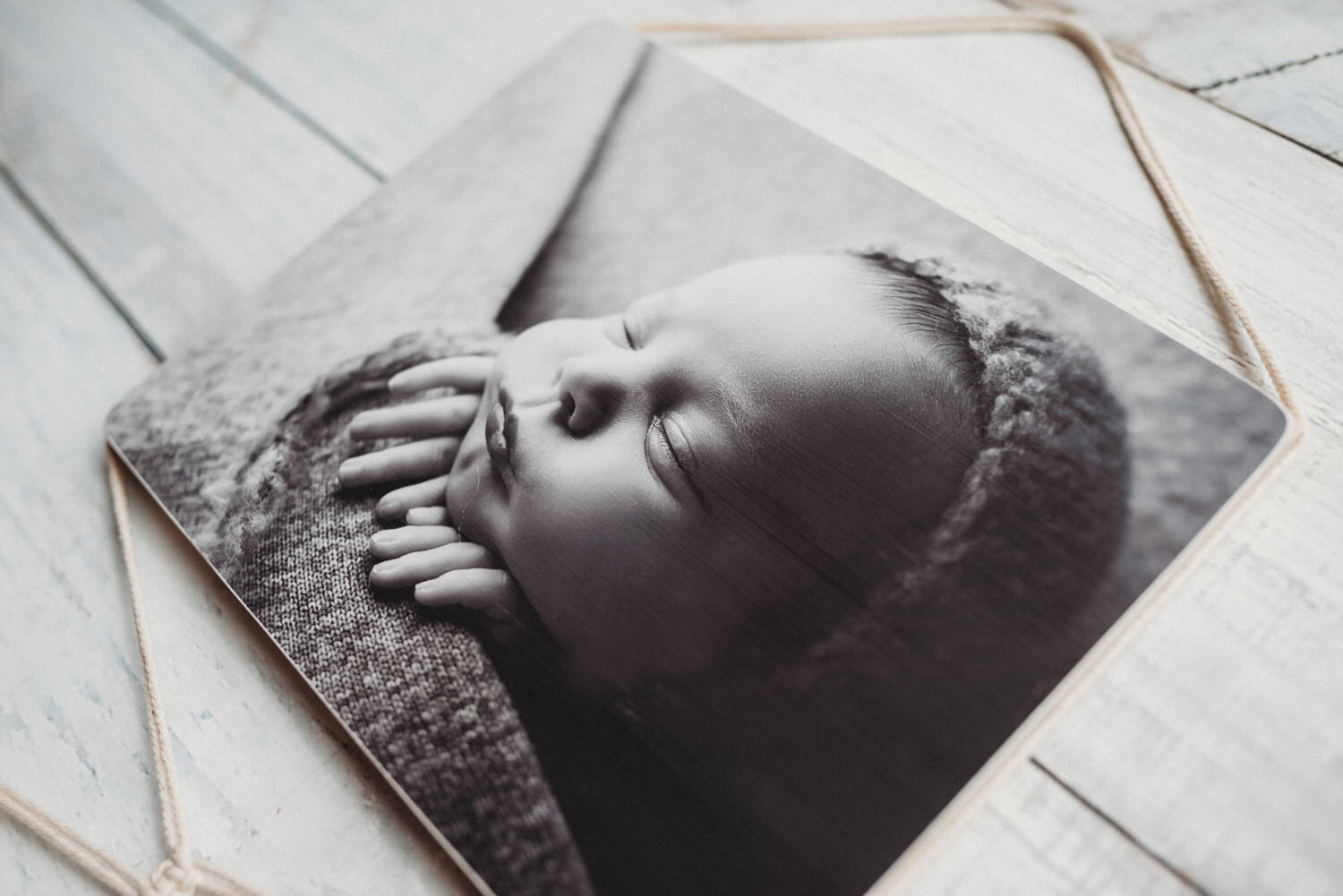 Professional photo of newborn baby boy on wood macramé print. (Copy) (Copy)