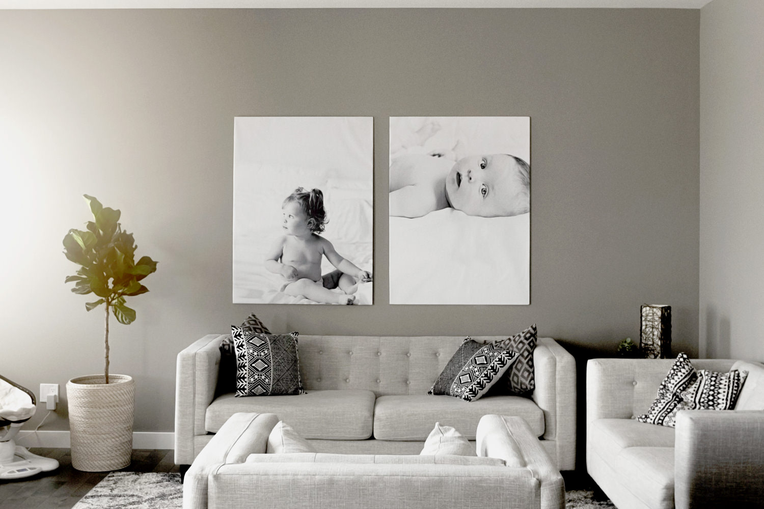 Two canvases displayed above a sofa in a living room. (Copy) (Copy)