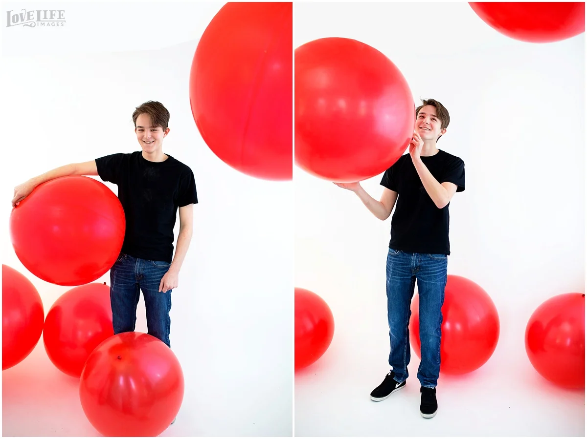 teenager in red balloon portrait room.jpg