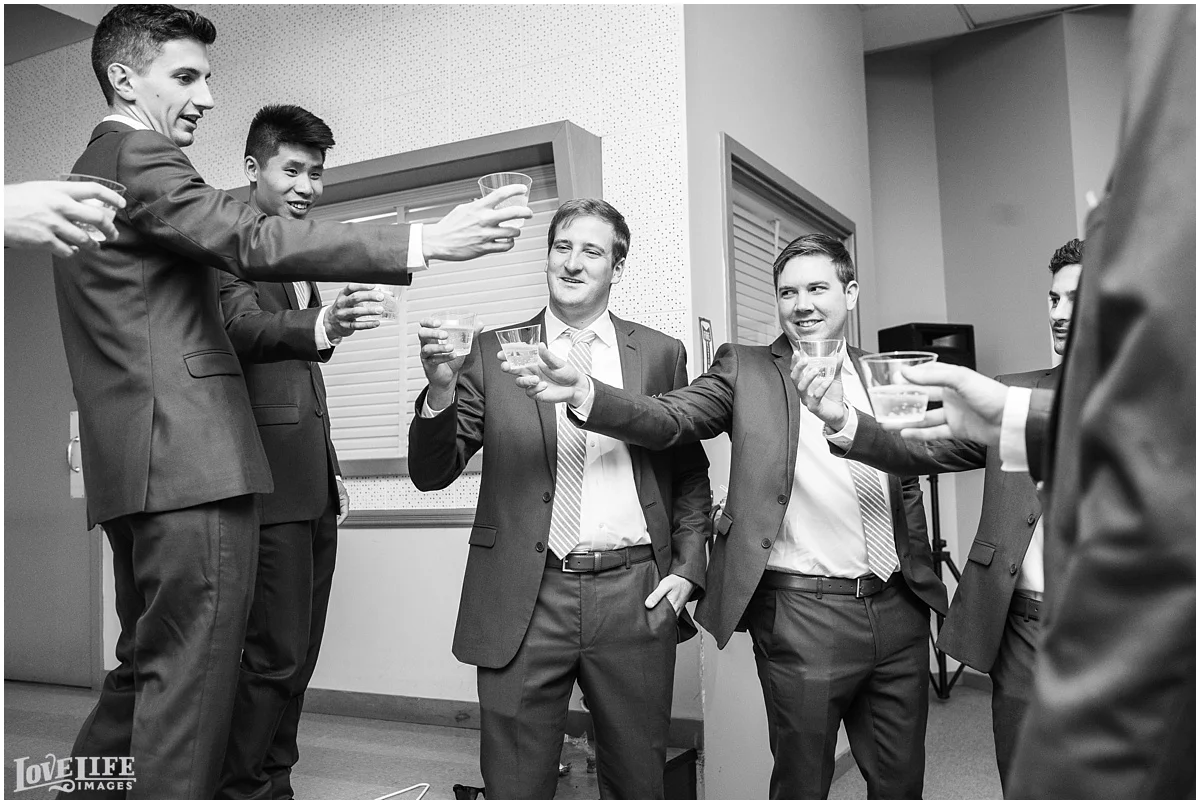 Baltimore Museum of Industry Wedding groomsmen toasting.jpg