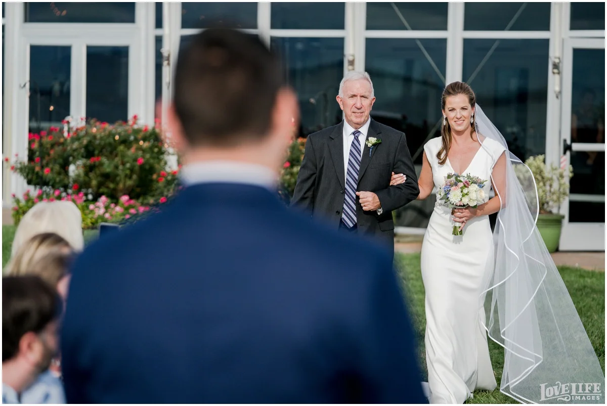 Silver Swan Bayside Wedding bride coming down aisle.jpg