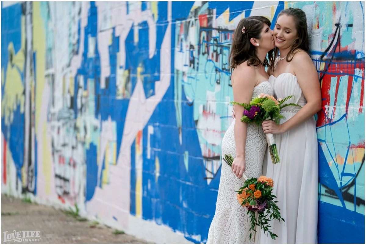 Same Sex Brewery DC Wedding brides portrait with mural.jpg