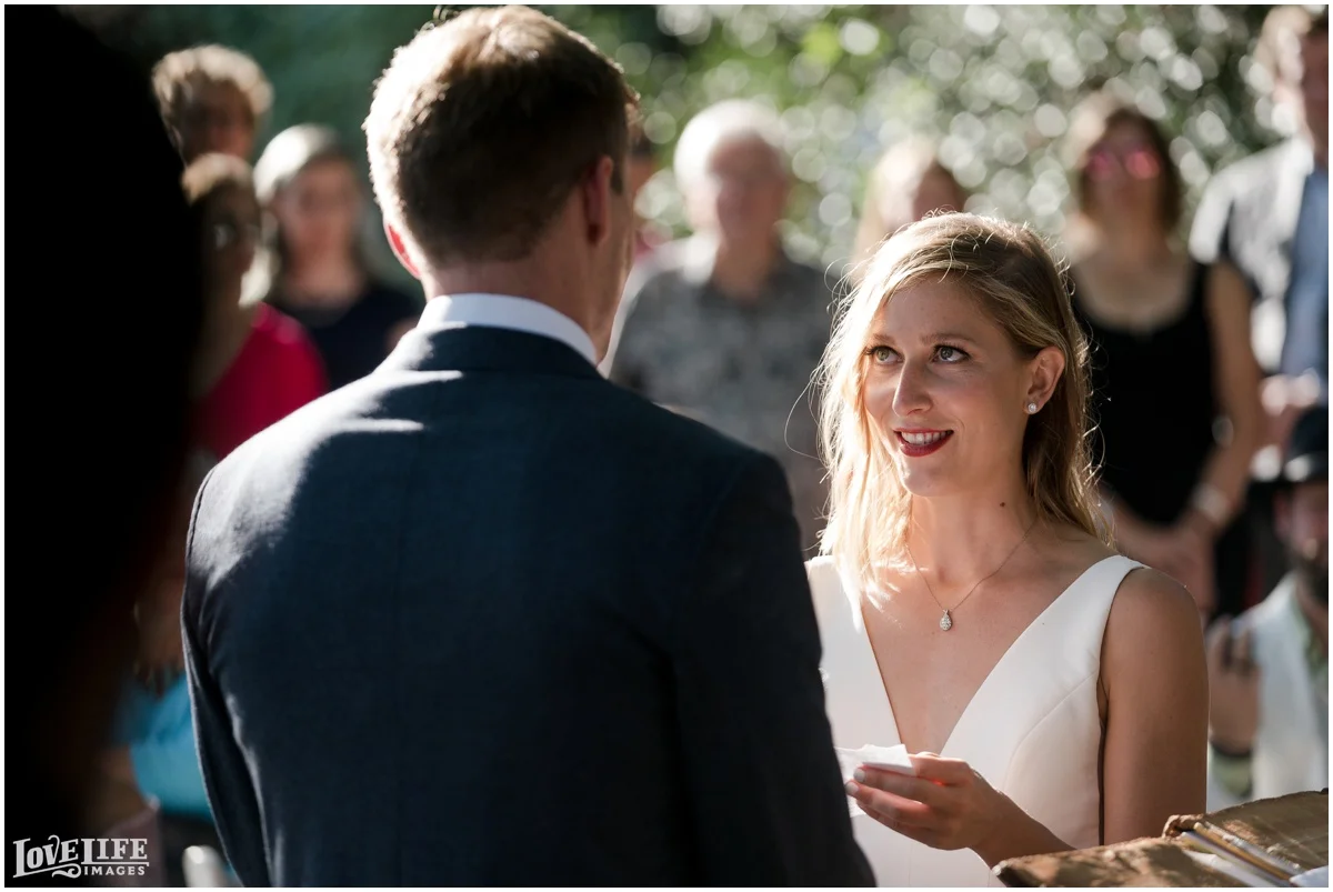 River Farm Wedding ceremony exchanging vows.jpg