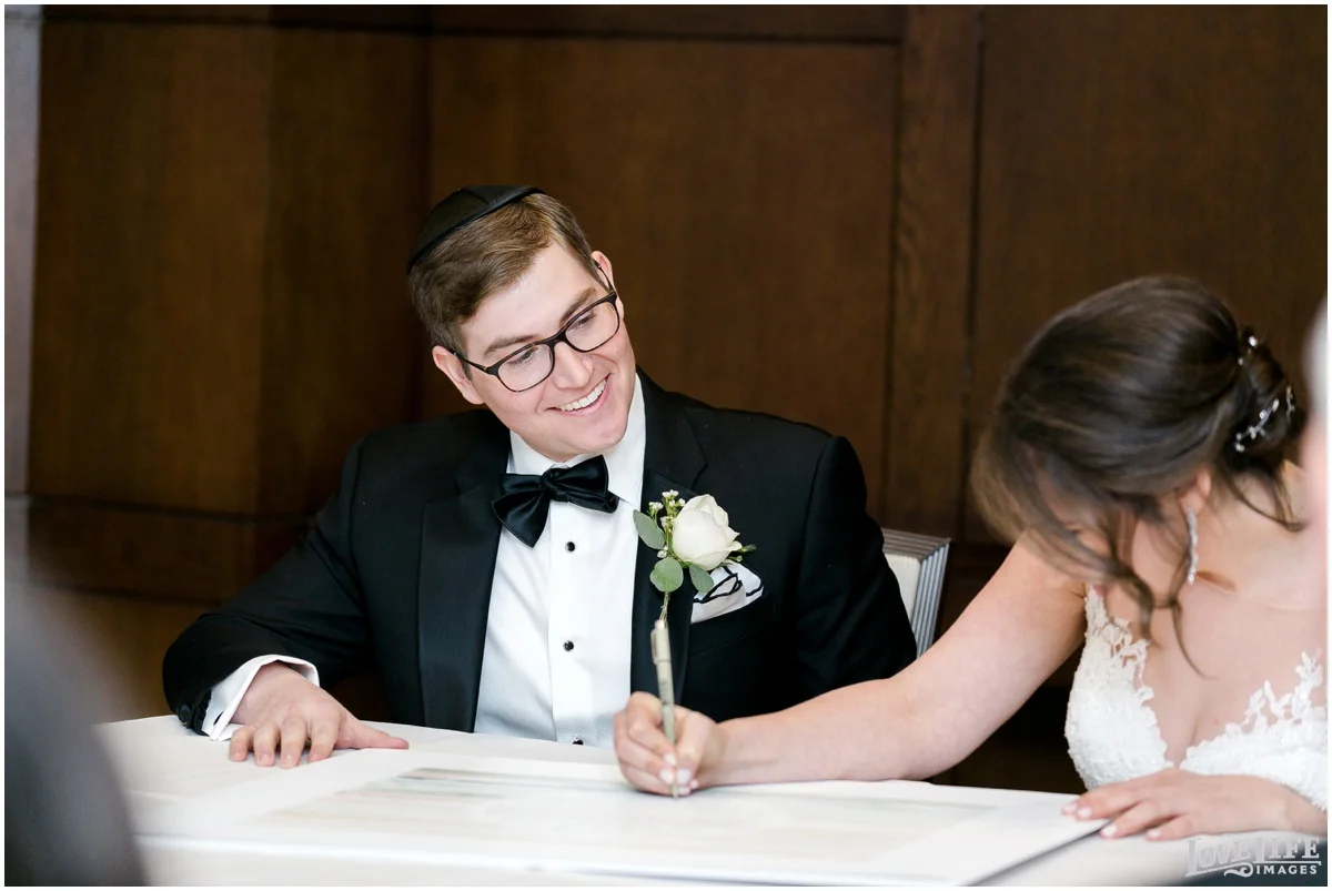 Fairmont DC Wedding bride signing ketubah.jpg