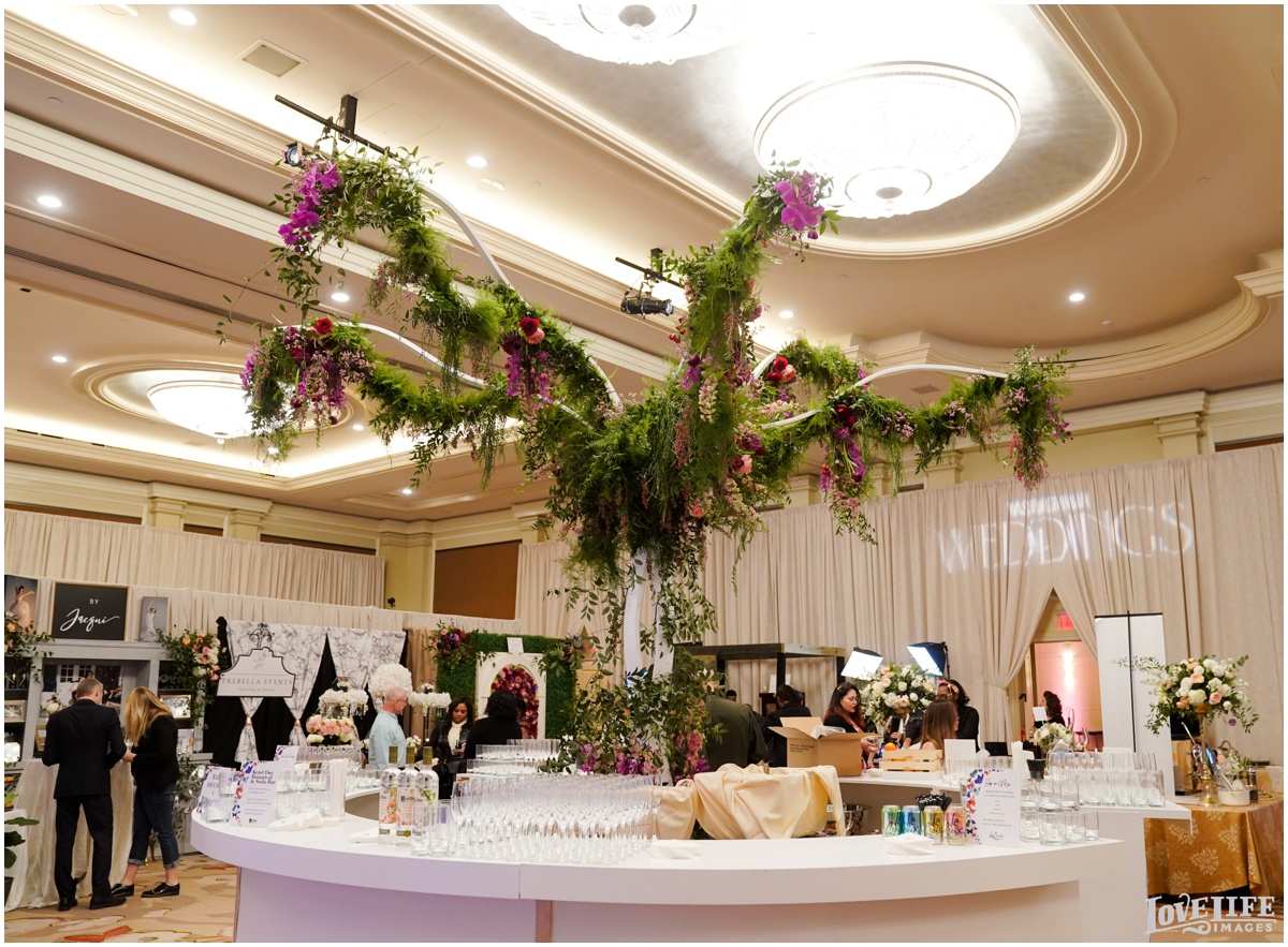 Nature by Design provided the florals for this statement tree at the main ballroom bar, built by BD3 Design.