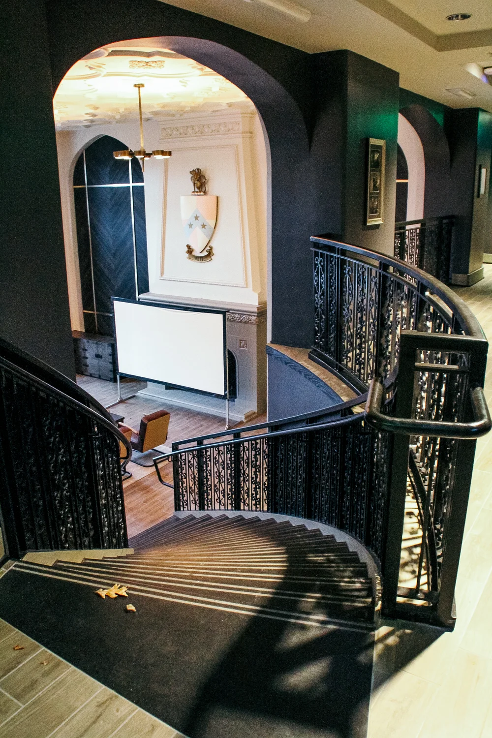 Close view of curved decorative railing and the stair opening