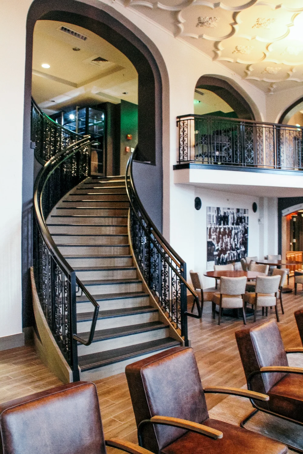 Curved staircase with decorative steel railing from the J.L. Walter portfolio