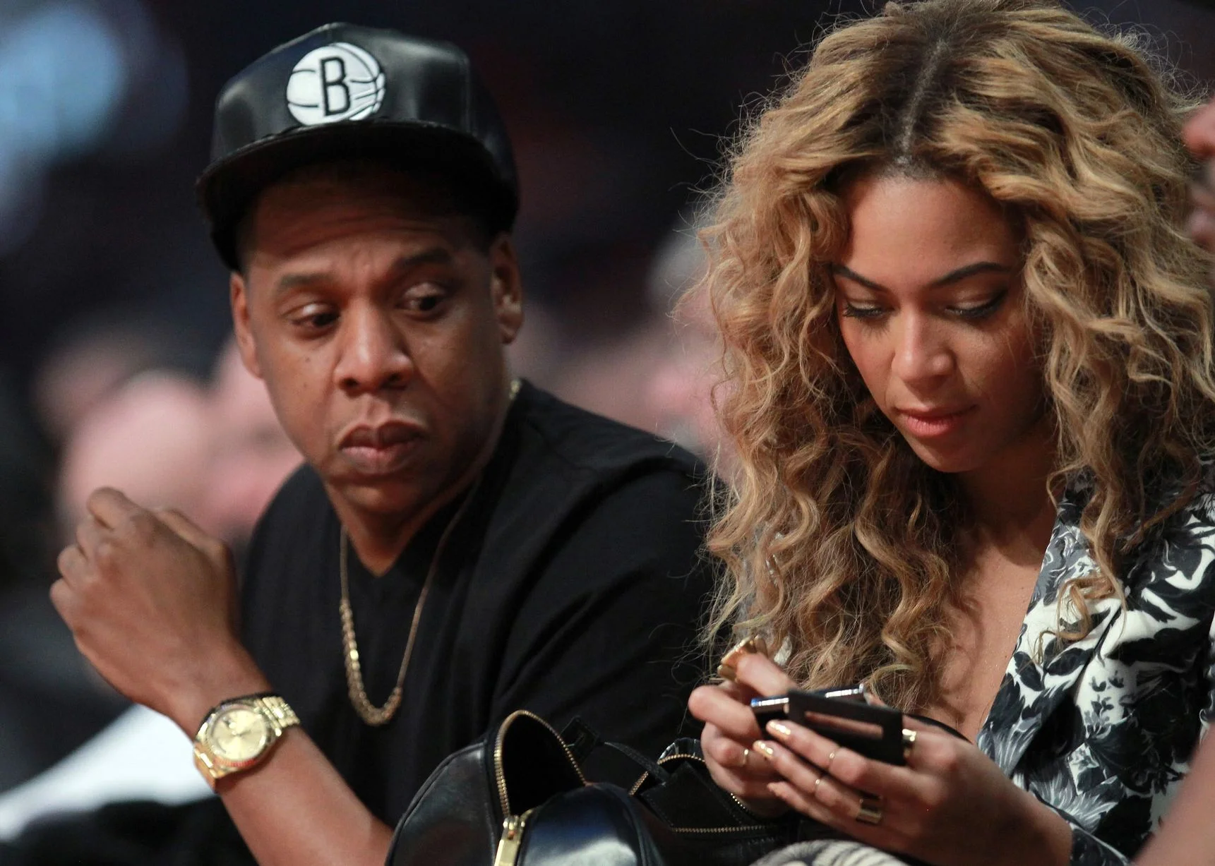 Jay-Z-looks-over-at-wife-Beyonce-during-the-2013-NBA-All-Star-game.jpg
