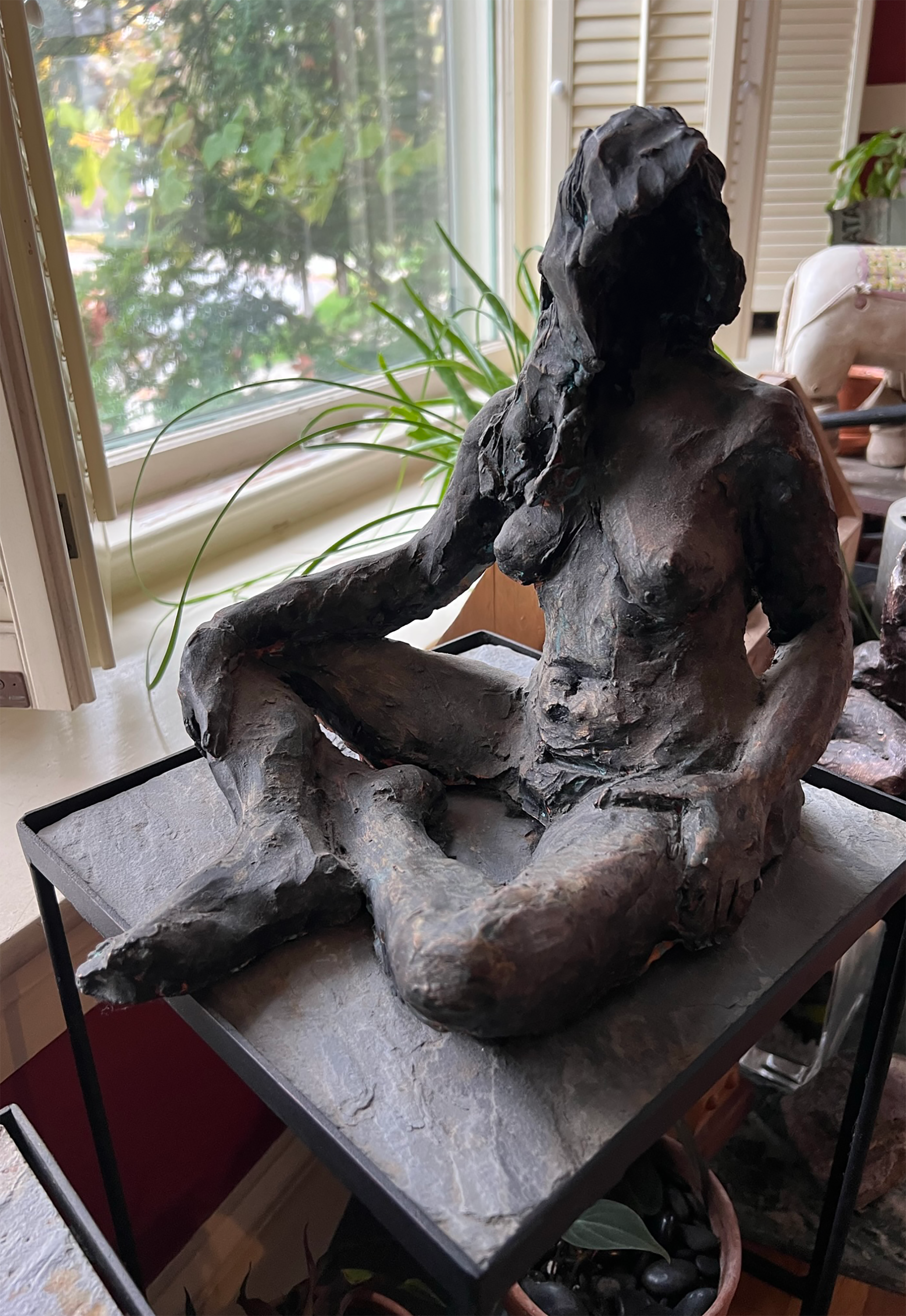 Cross-legged Nude sculpture