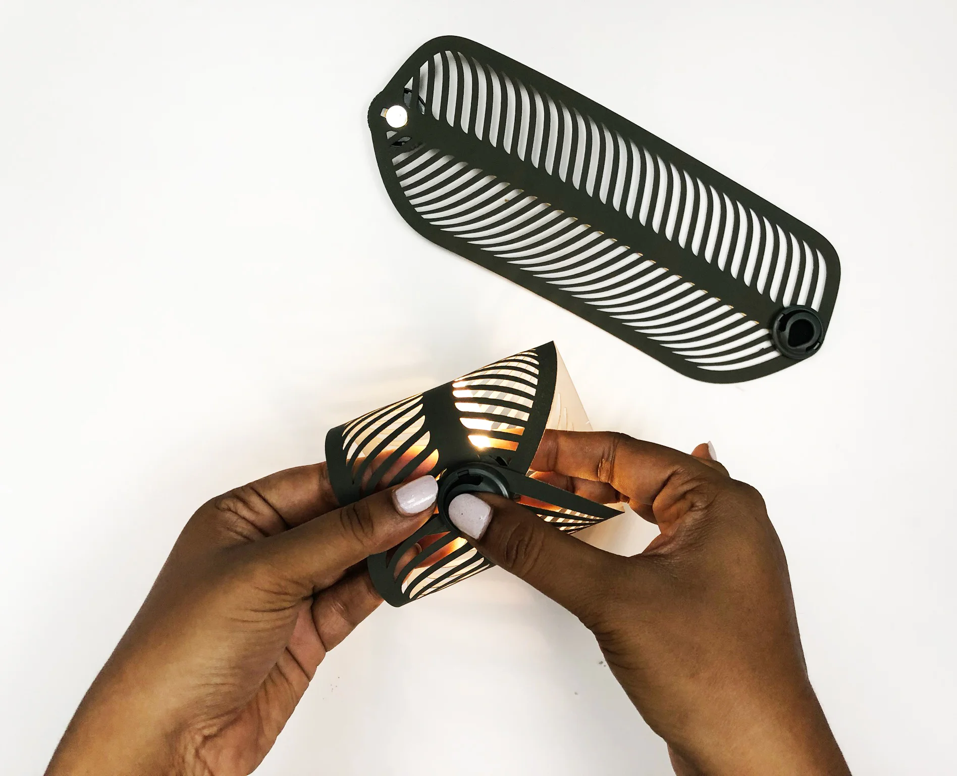 Snap Diah's ends together to turn on. We like to assemble Diah with the LED strip inside. Feel free to do it the other way around for a different feel