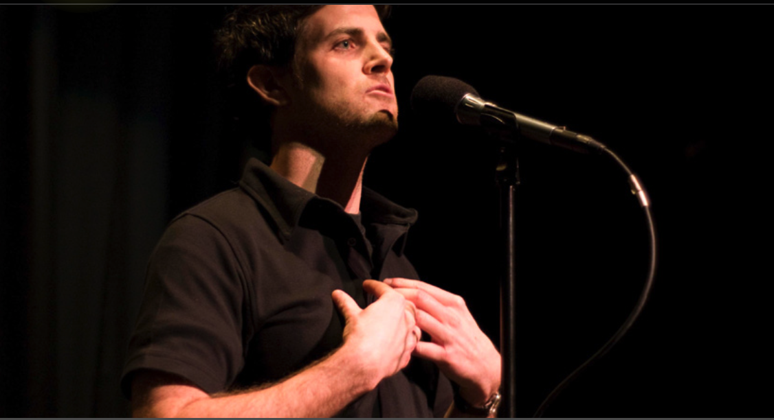 Terence Mickey on stage at The Moth, NYC.