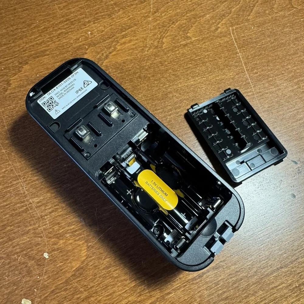 rear view of blink doorbell showing open battery compartment