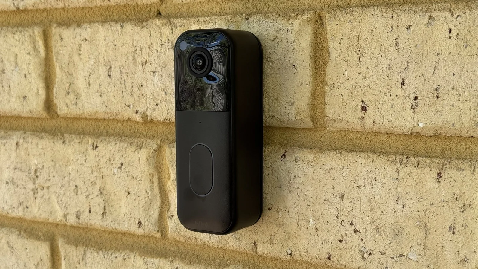 Blink 2nd gen video doorbell mounted on a brick wall