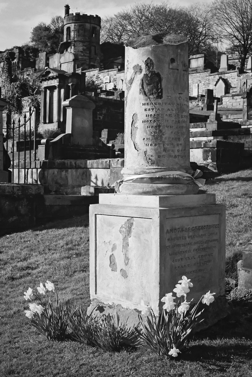(1235) Broken White Pillar, Andreas Gregorowicz Polish Lawyer, Surgeon and Freedom Fighter with Watch Tower in Background, New Calton Burial Ground, Regent Road, Edinburgh, Scotland. 35mm film copy.jpg