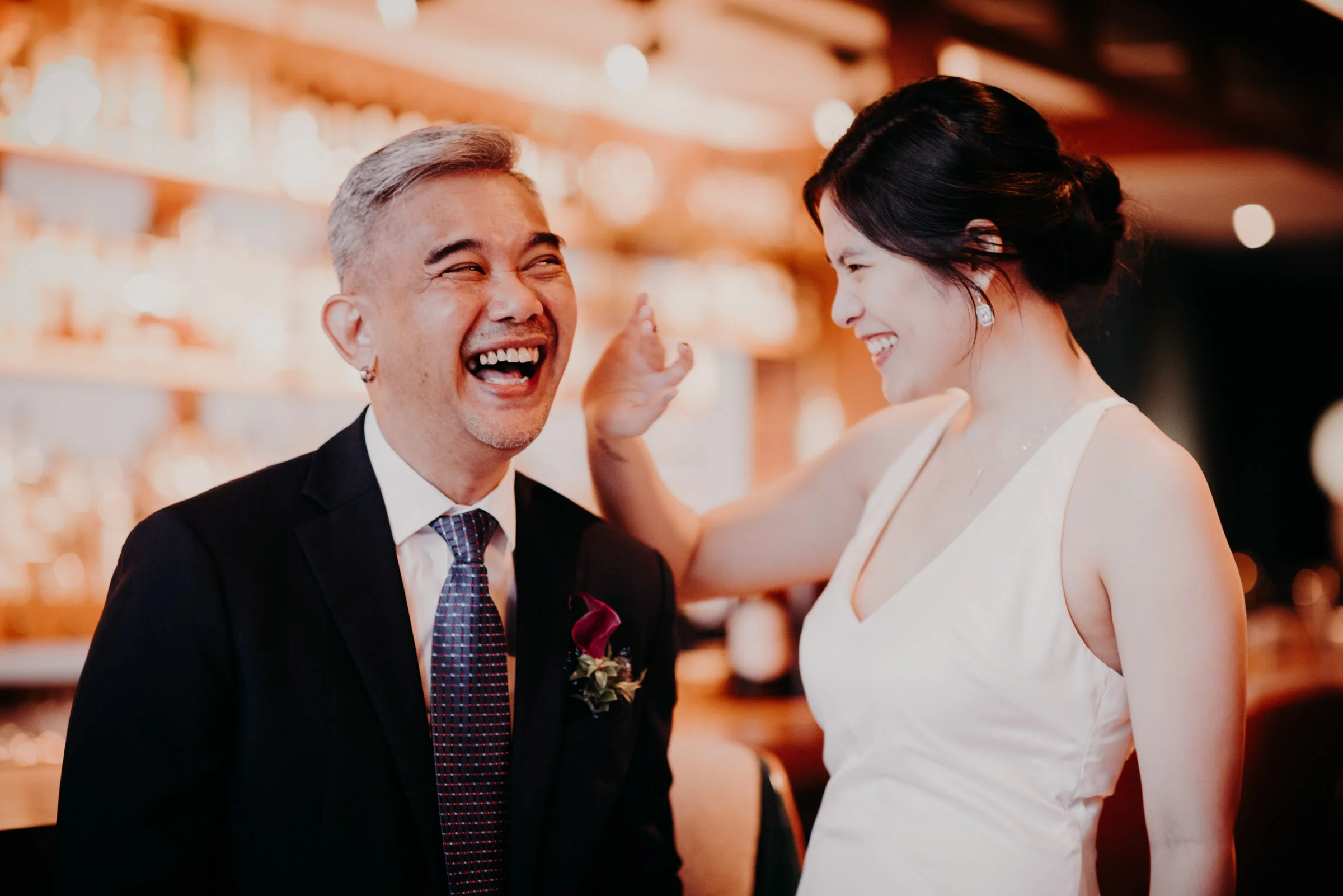 Brian and Sarah having a quick and fun photo session at the bar before their solemnization