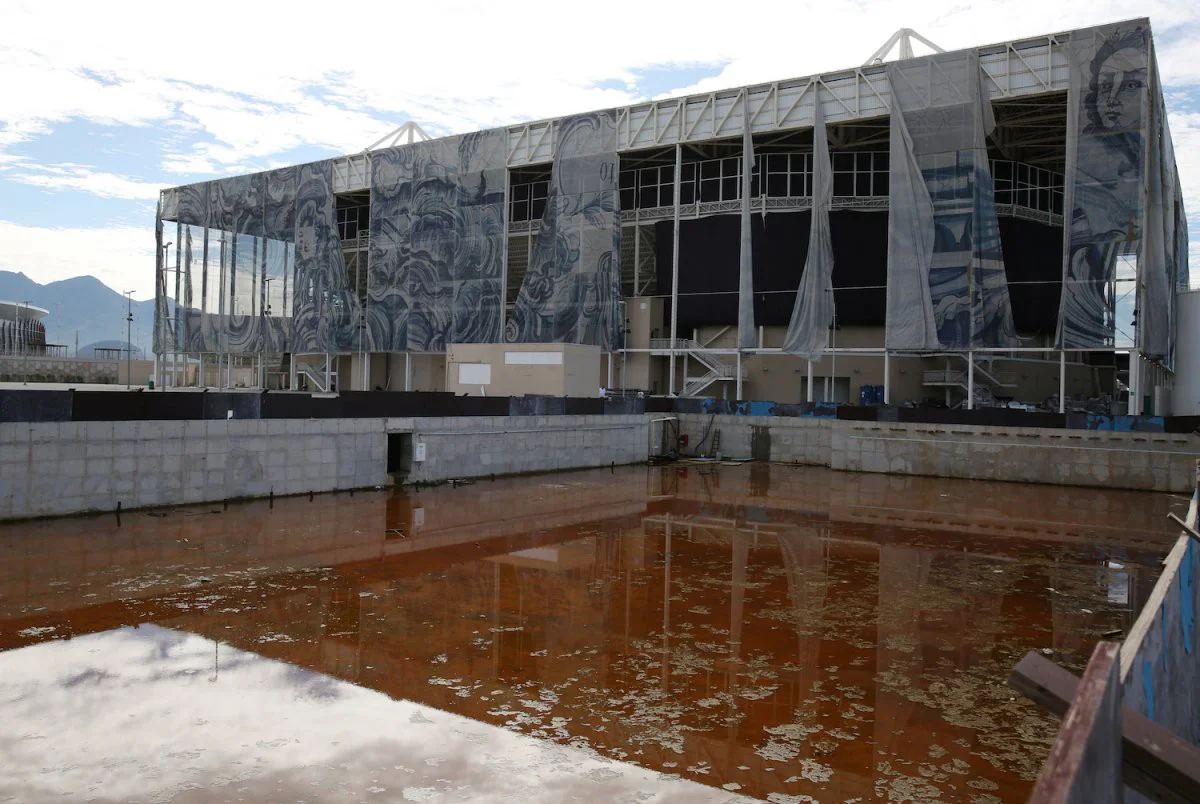 One practice pool has turned orange, and the structure next to it is quite literally falling apart | Pilar Olivares/Reuters