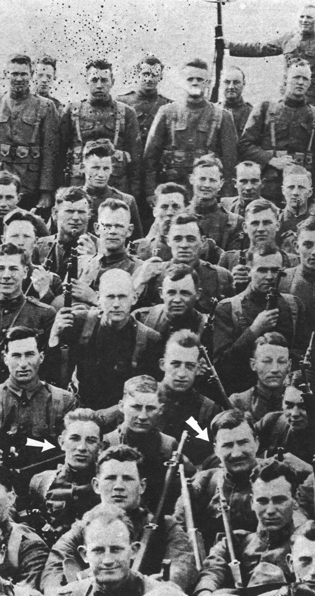 Henry Gunther with fellow soldiers. He is pictured at the right arrow.