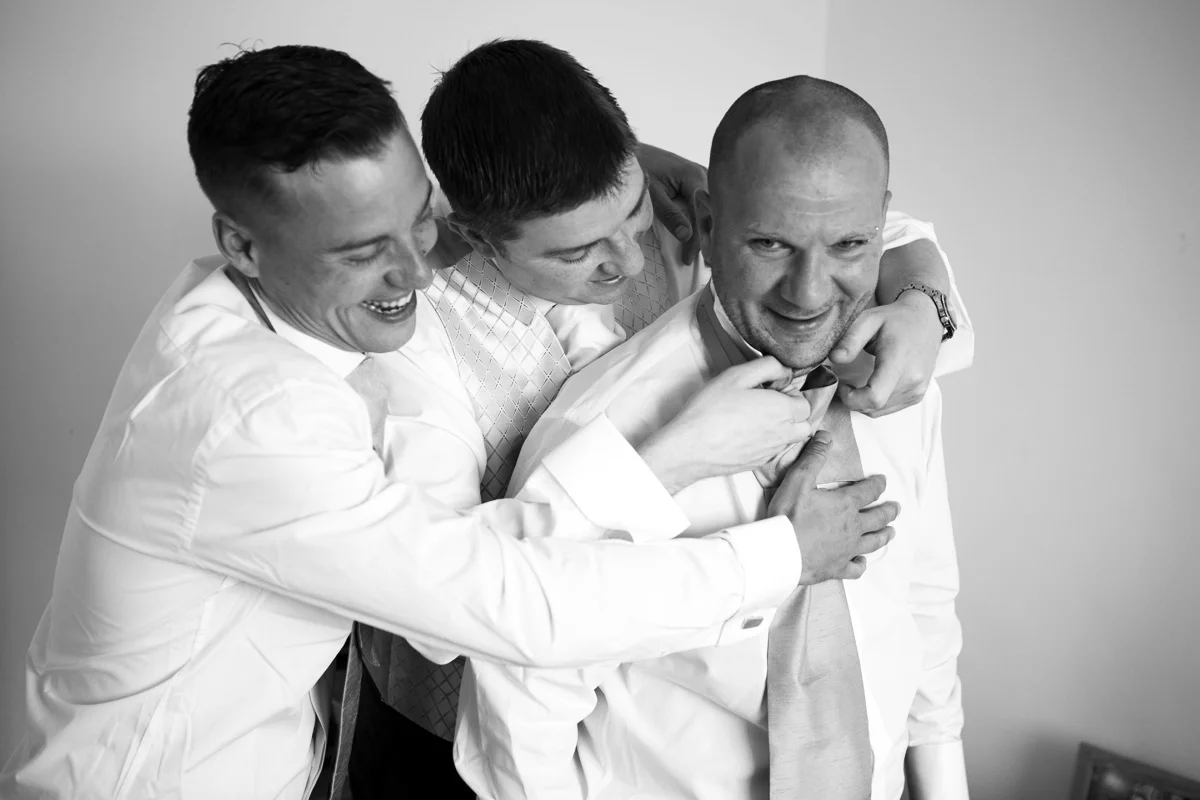 Let’s fix that tie. Fun with the groom and groomsmen