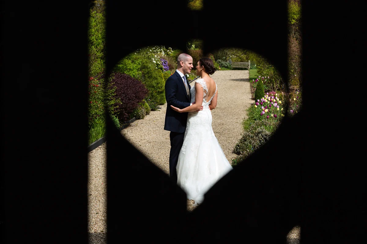 Bride and groom pictured in a heart at Gaynes Park