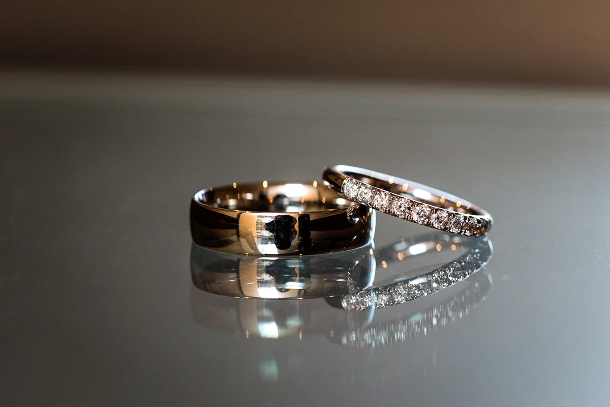 Wedding rings on a glass top table