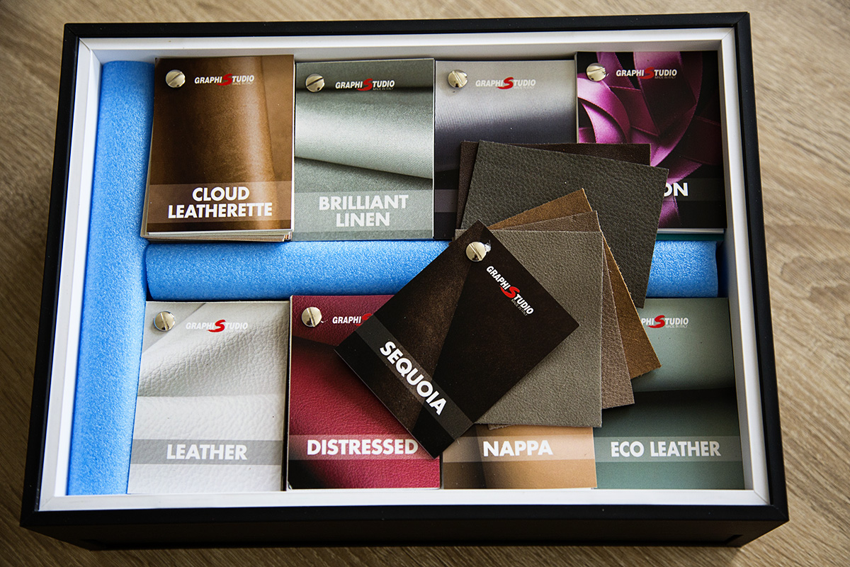 The Graphistudio swatch box which covers the entire range of album covers, box materials and ribbons available to clients to completely personalise their wedding albums