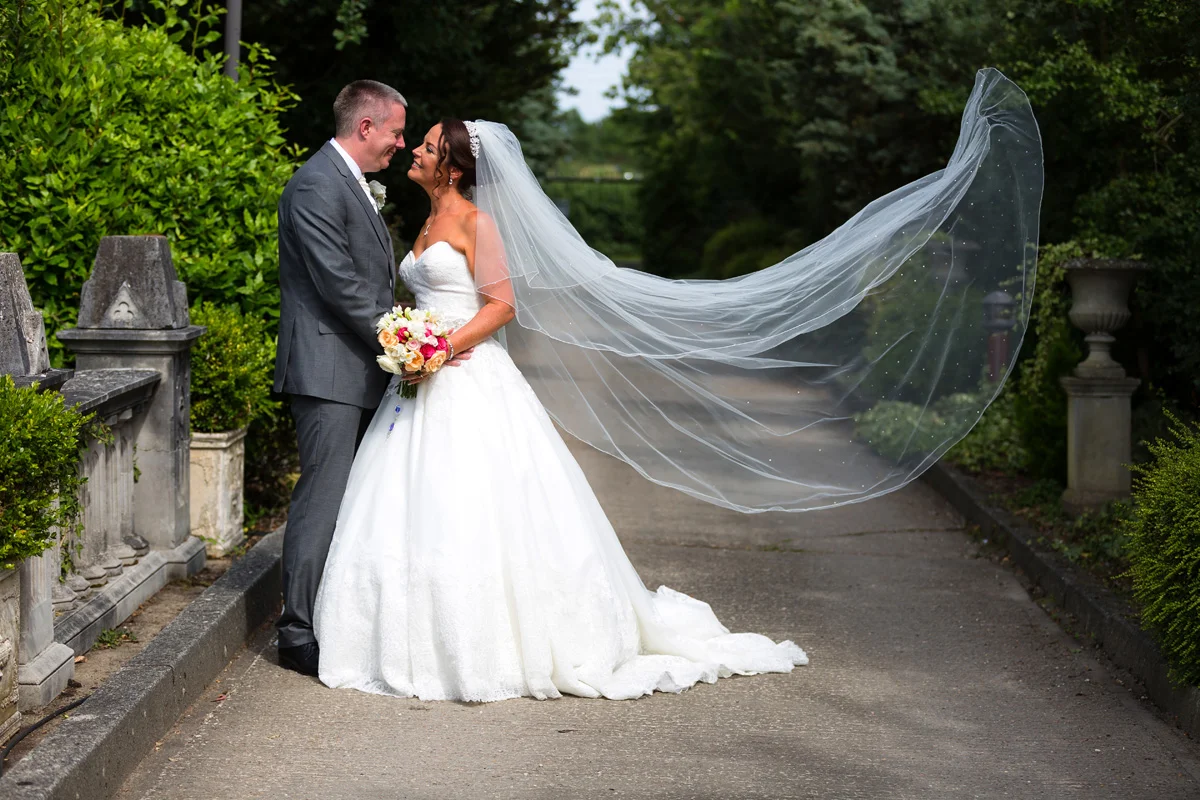 The bride’s flowing veil at her Essex wedding