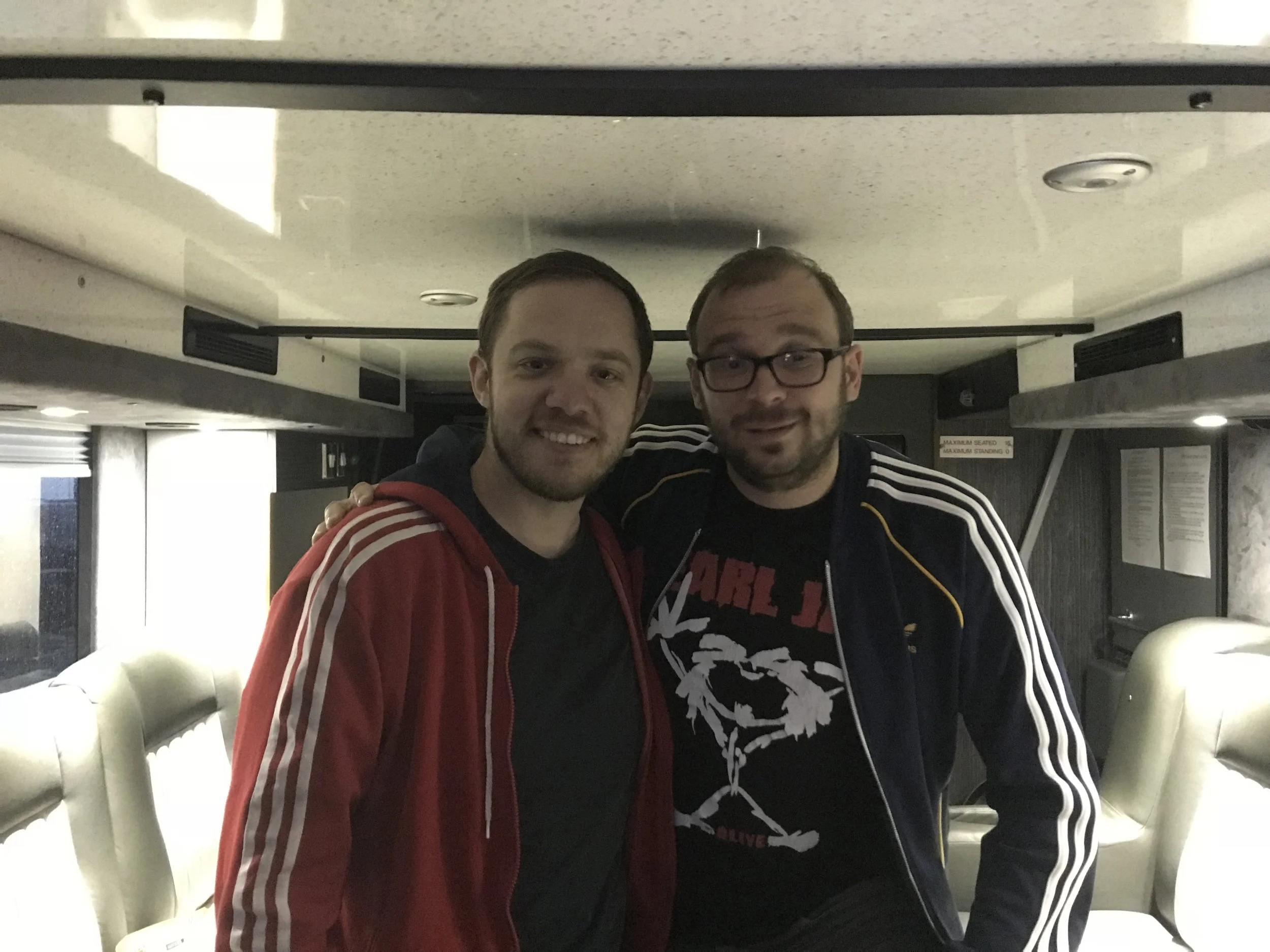 Ben re-living the 90's with Jon in their finest Adidas gear as he draws one all with me on tour bus appearances.