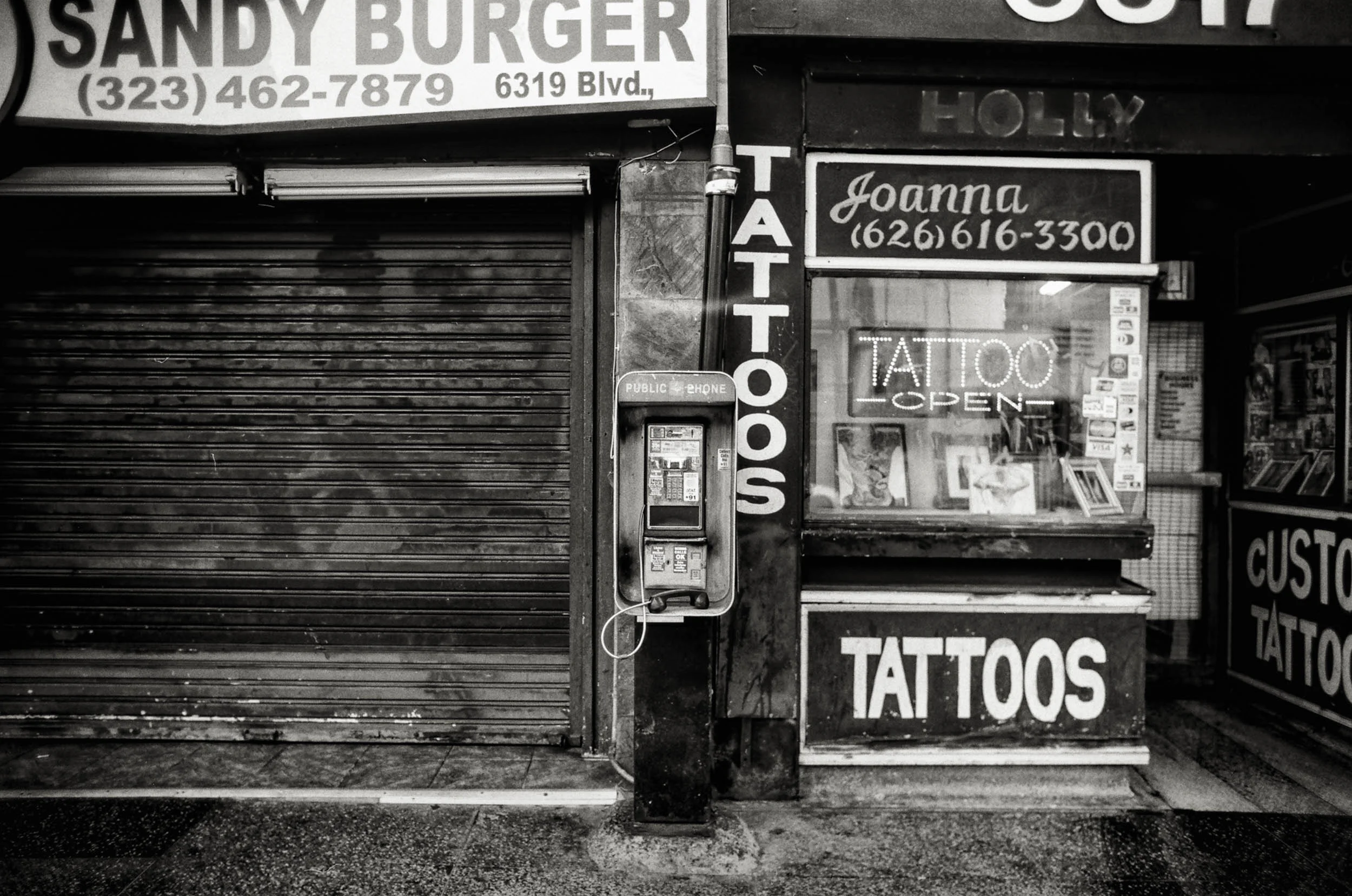 I photograph the phones along with their surrounding environments because it helps me identify their locations, but as the phones disappear, I’ve also noticed the surrounding businesses changing. In this case, both the phone and the burger restaurant are gone.