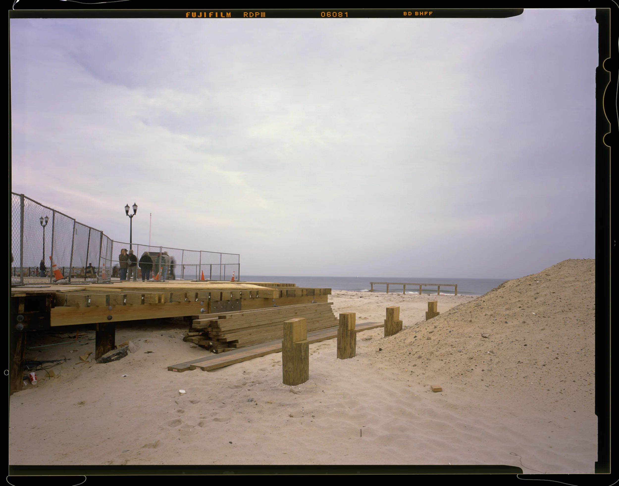 Re-Building the Boardwalk, Seaside, NJ. 2014. 4x5 Shen-Hao. On September 13th, 2013, this is the point of the boardwalk that was split by a fire officials in an effort to stop the fire from spreading. The fire devastatingly destroyed more than 50 businesses and Funtown Pier. Officials determined the fire was caused by floodwaters to an electrical panel under the boardwalk.