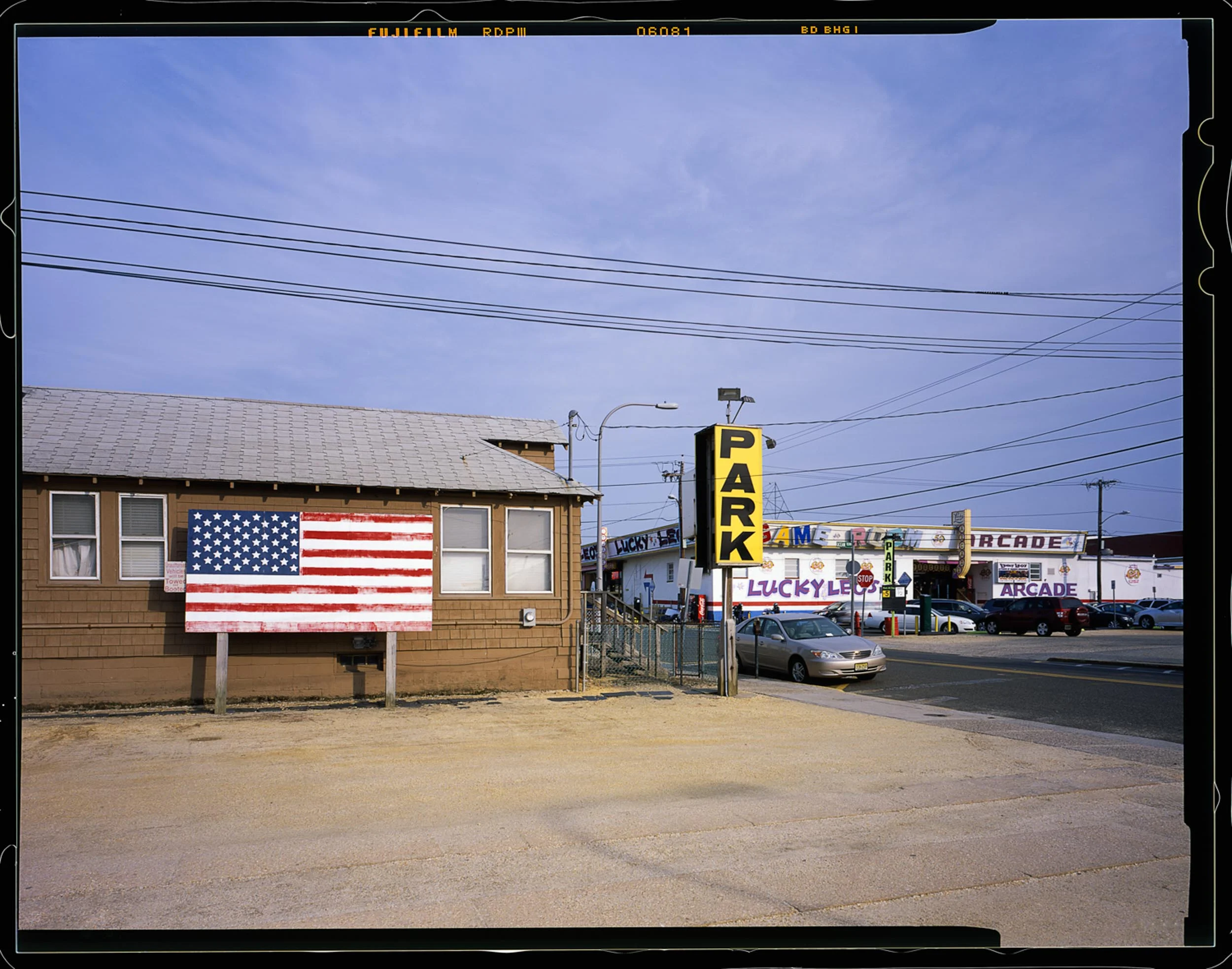 Park, Seaside, NJ 2014 4x5 Shen Hao. Parked here one day and saw this cool view of the back of the boardwalk with this giant American flag.