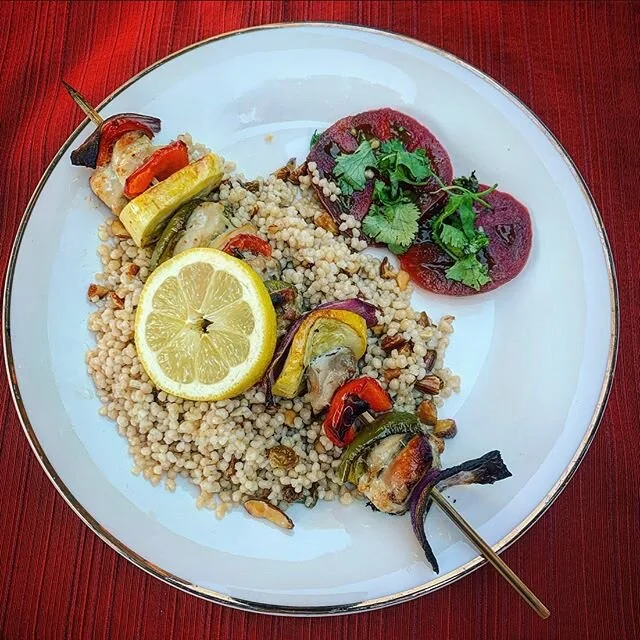 I marinated chicken and veggie kebab fixings in Italian dressing for 24 hours, put it on a bed of whole wheat couscous and sliced up a gorgeous Bradley County tomato. 😍.