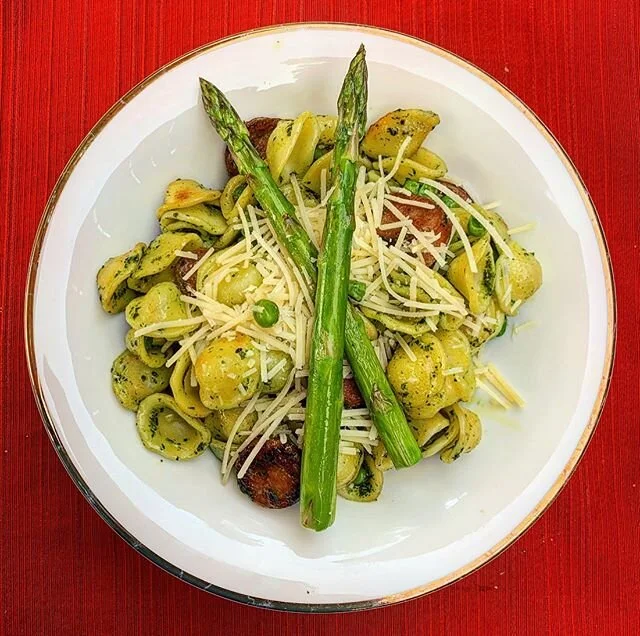 Pesto orecchiette with asparagus, peas and sausage.
