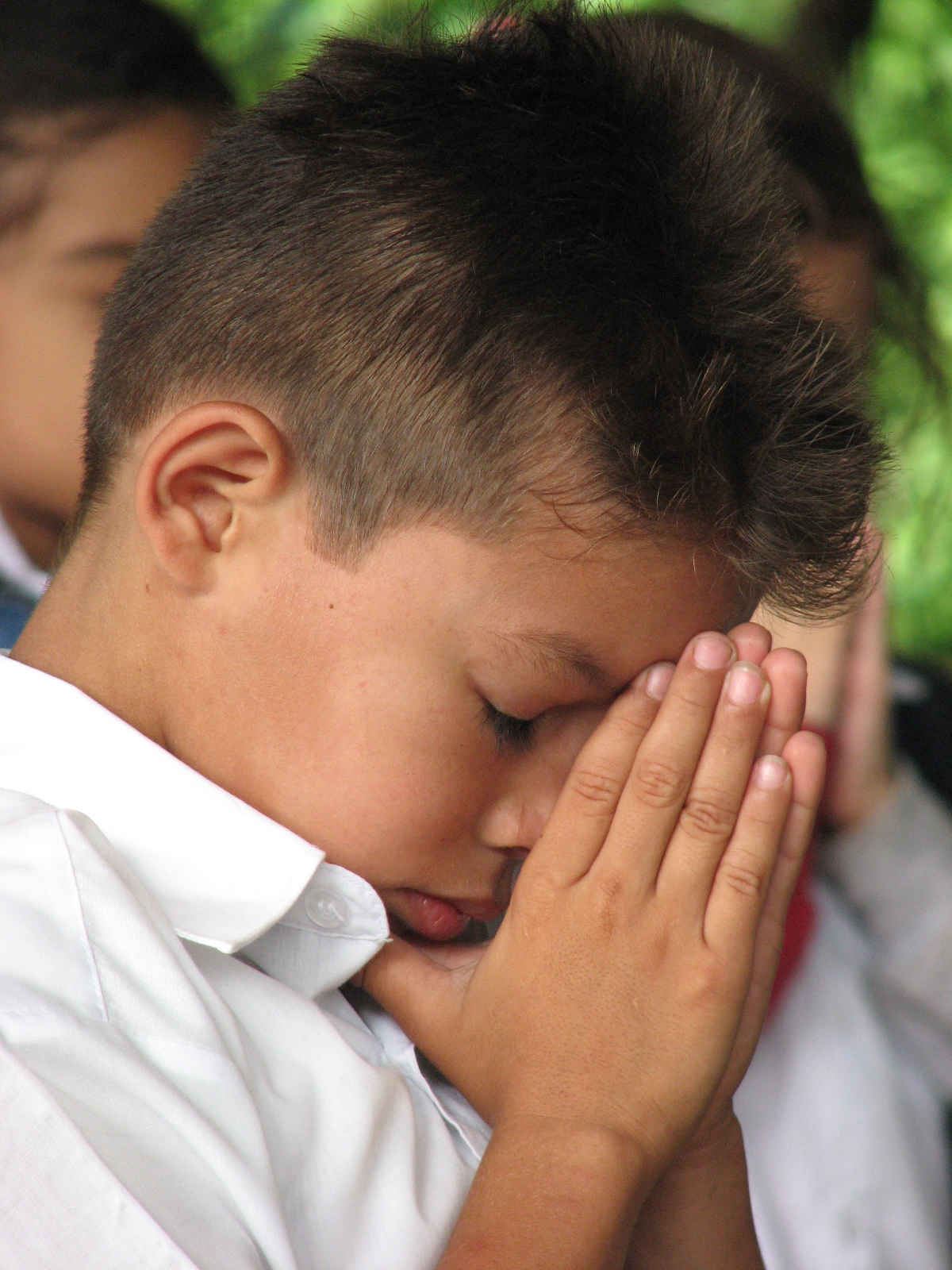 Boy praying photo.JPG