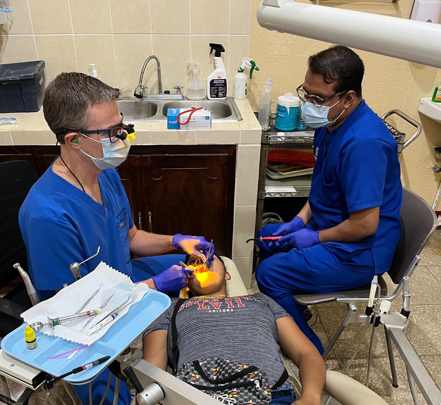 Dr McFarlane with dental patient.jpg