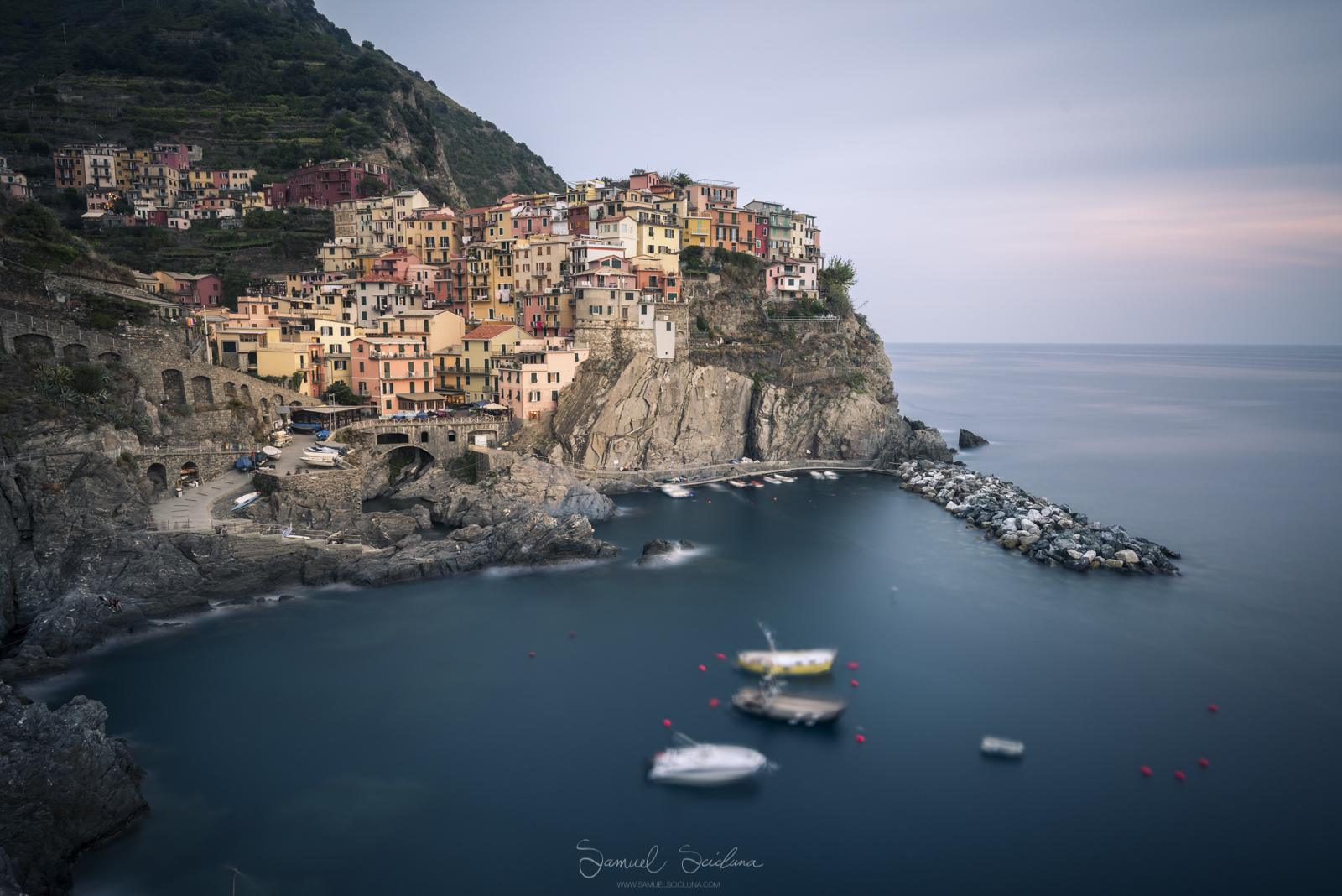 An 8 minute exposure of Manarola at sunset using a Haida Pro 100 filter holder and Haida 10 stop neutral density filter.
