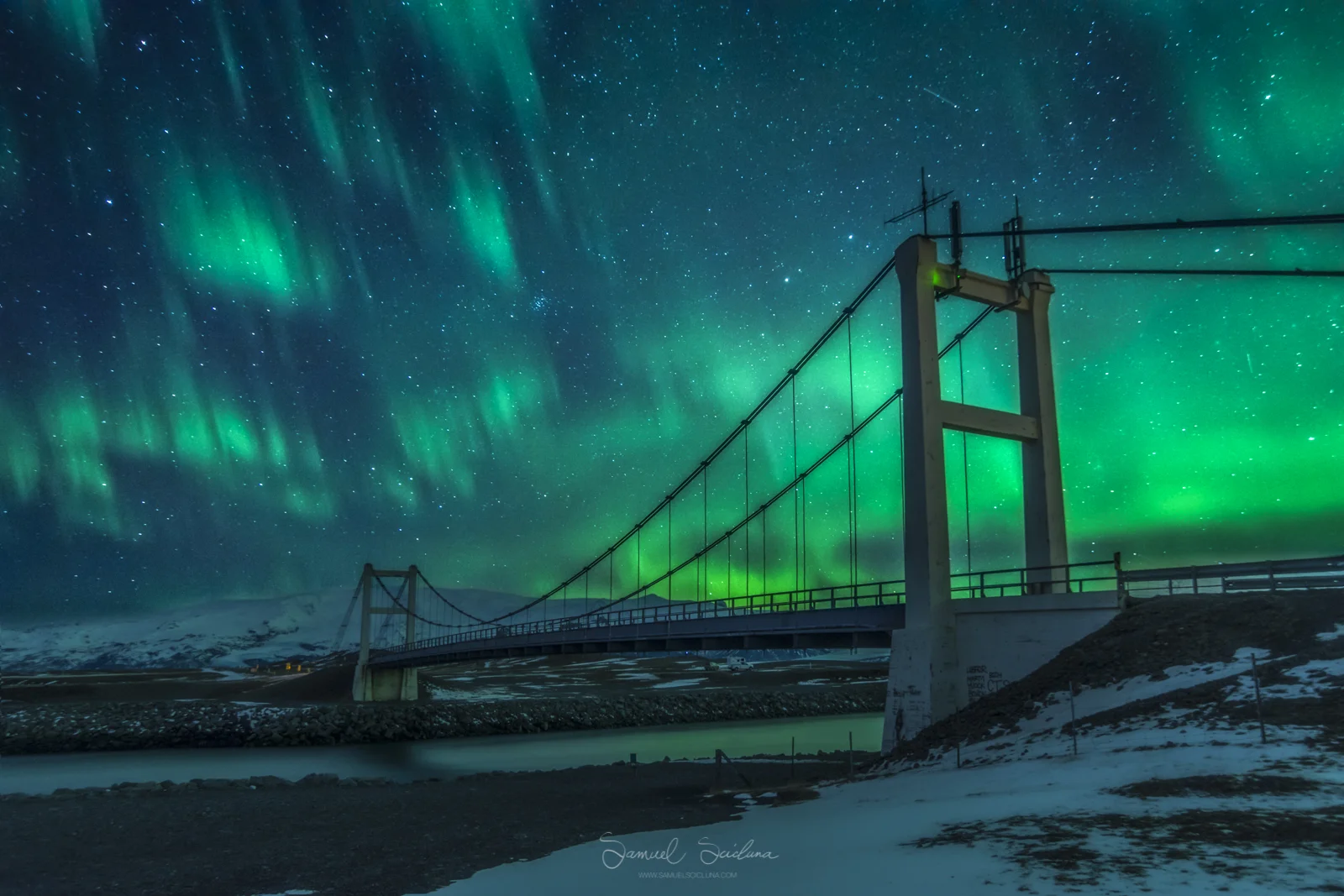 An explosion of Auroral activity above the famous suspension bridge at Jökulsárlón glacier lagoon.