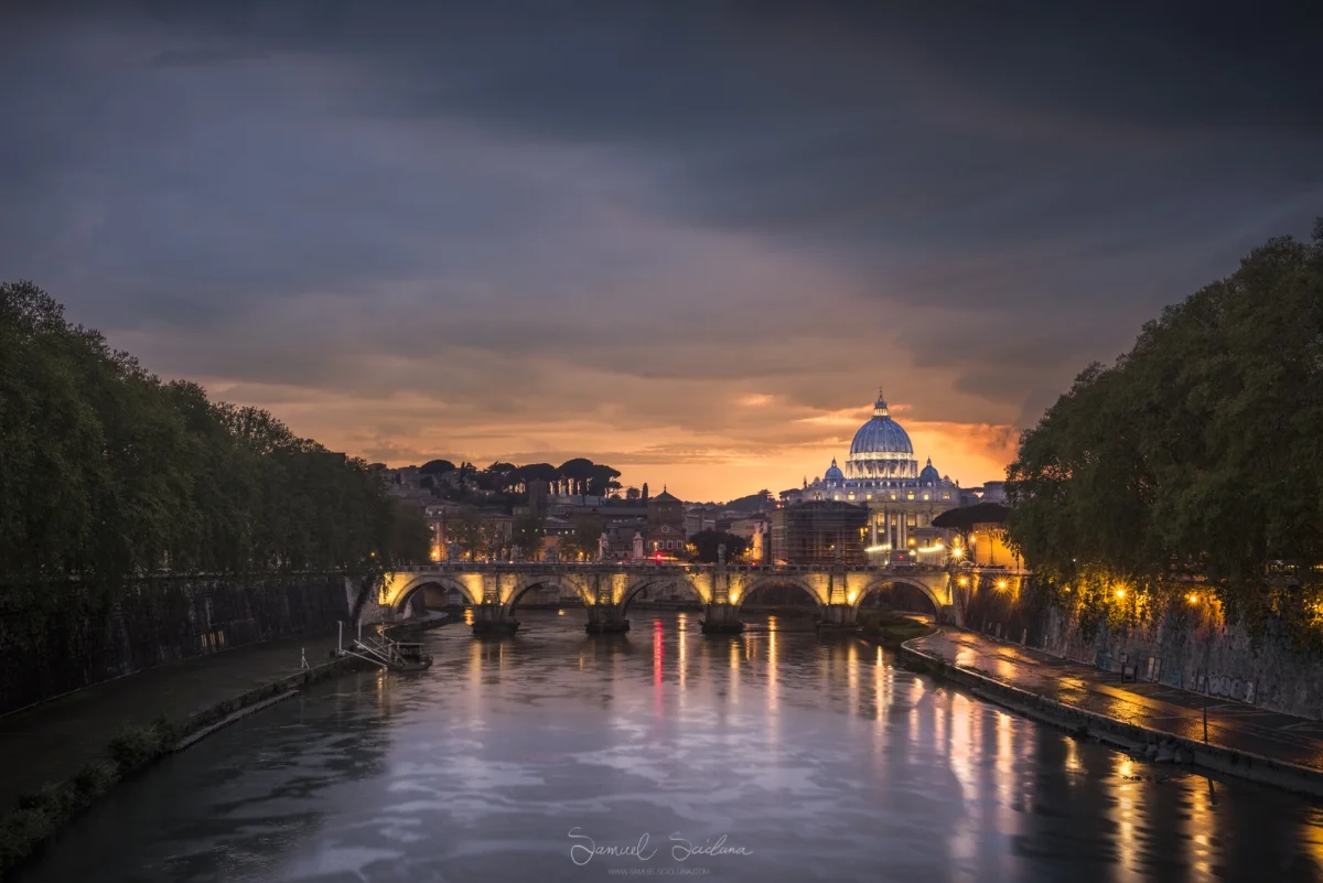 A classic view. The Vatican is visible from a bridge crossing the river Tiber.