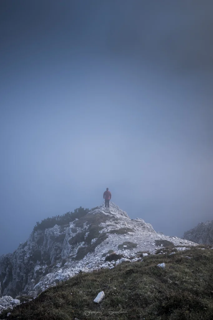 Low clouds covering the Cadini di Misurina during sunset.