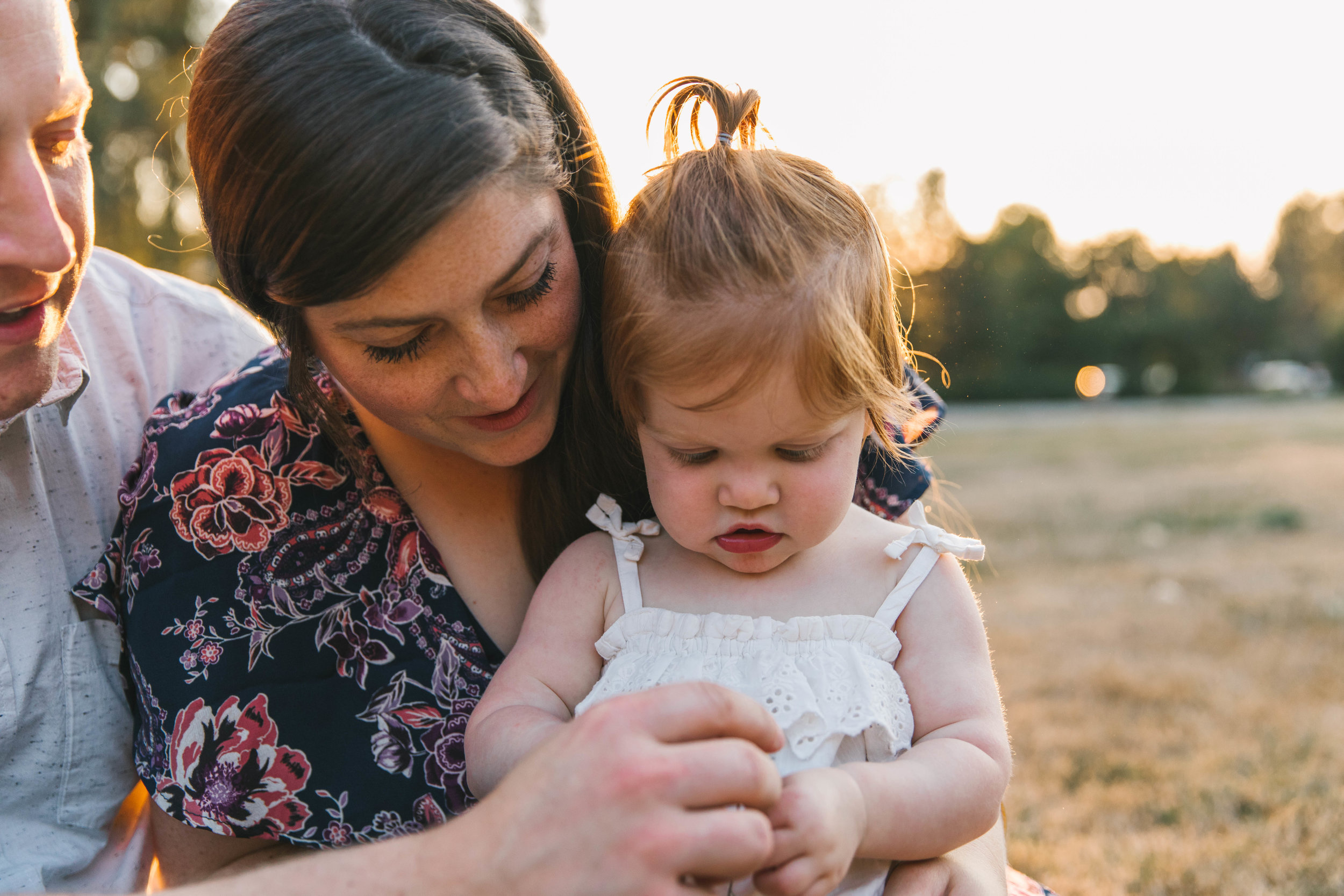 Playful and sweet family session in Issaquah at golden hour and twilight Mom and Dad with their toddler photographed by Chelsea Macor Photography in a playful and intimate way.jpg