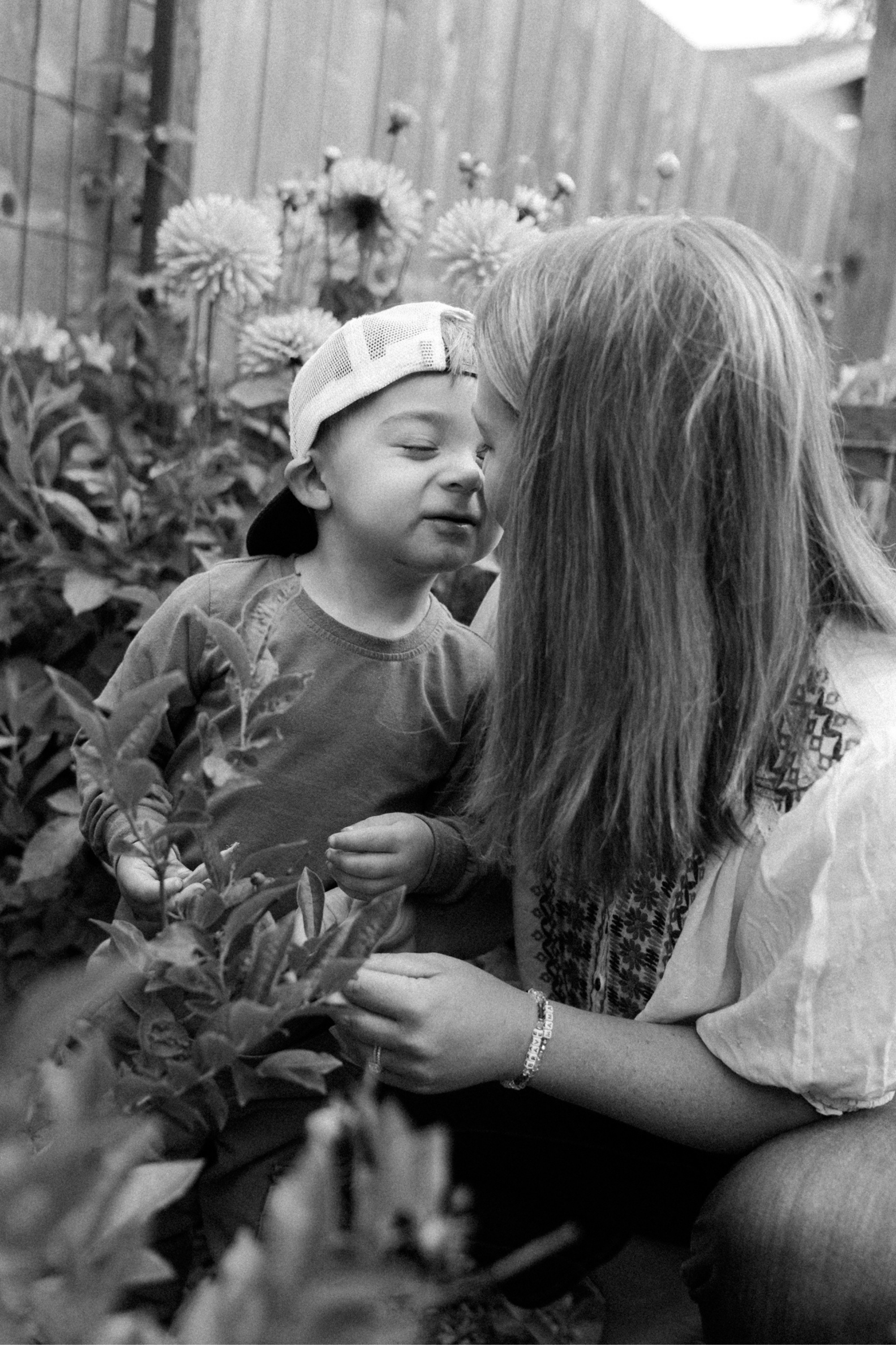 Photograph of a mother and her child in his Seattle garden by Chelsea Macor