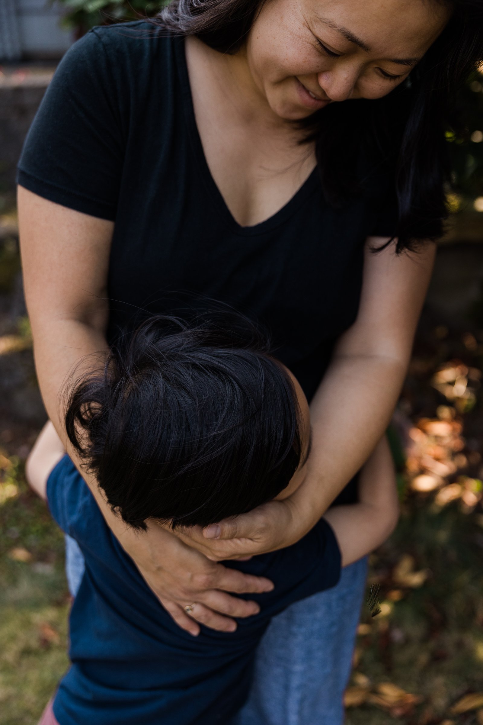 close up on mother hugging child